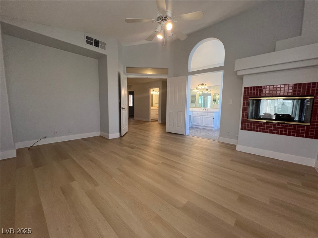 1624 Wandering Winds Way Las Vegas, NV 89128 - Photo 29 of 53 Master bedroom with two-way fireplace and a Ceiling fan.