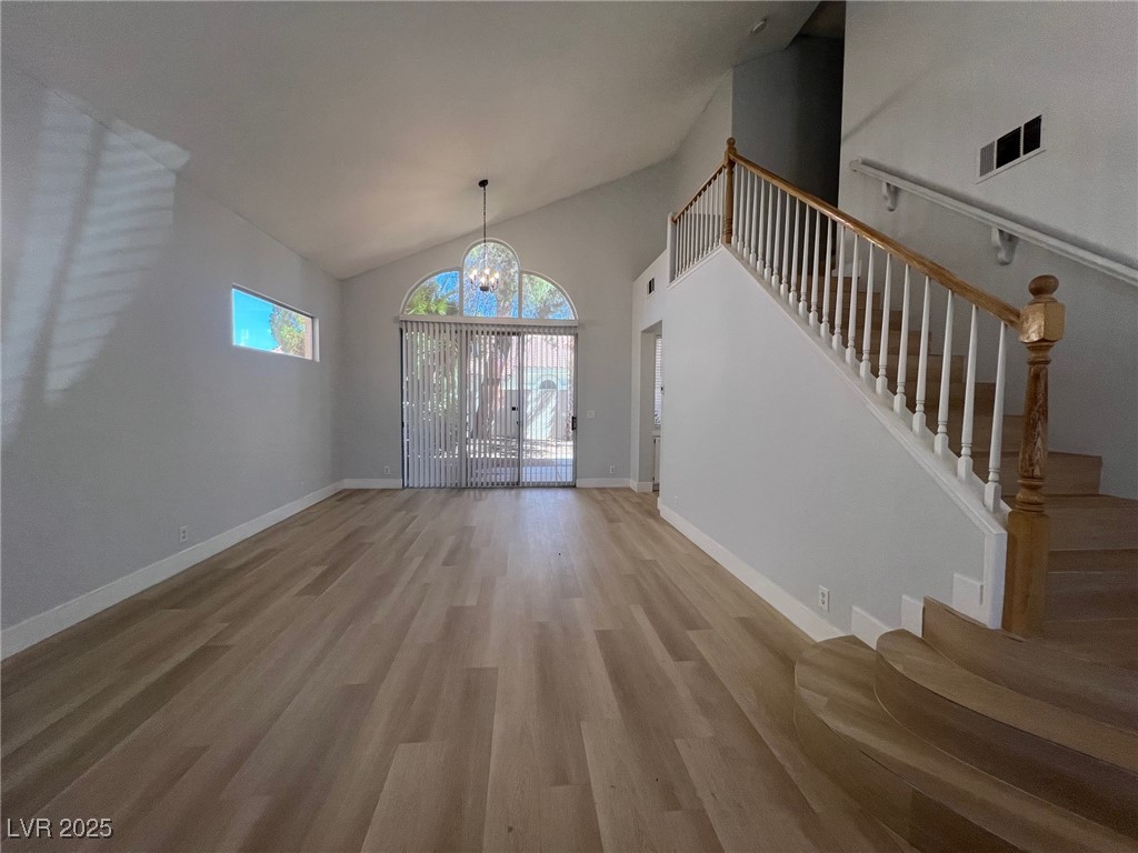 1624 Wandering Winds Way Las Vegas, NV 89128 - Photo 8 of 53 Livingroom/dining room, new upgraded baseboards throughout.