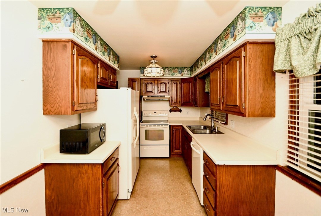 4858 Arbor Road Southwest Canton, OH 44710 - Photo 6 of 31 Kitchen featuring white appliances and sink