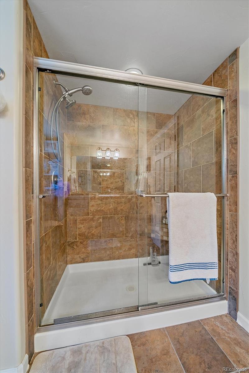 357 County Road 64 Shawnee, CO 80475 - Photo 16 of 50 a bathroom with a glass shower door