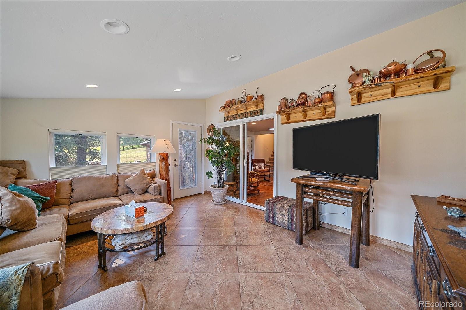 357 County Road 64 Shawnee, CO 80475 - Photo 18 of 50 a living room with furniture and a flat screen tv