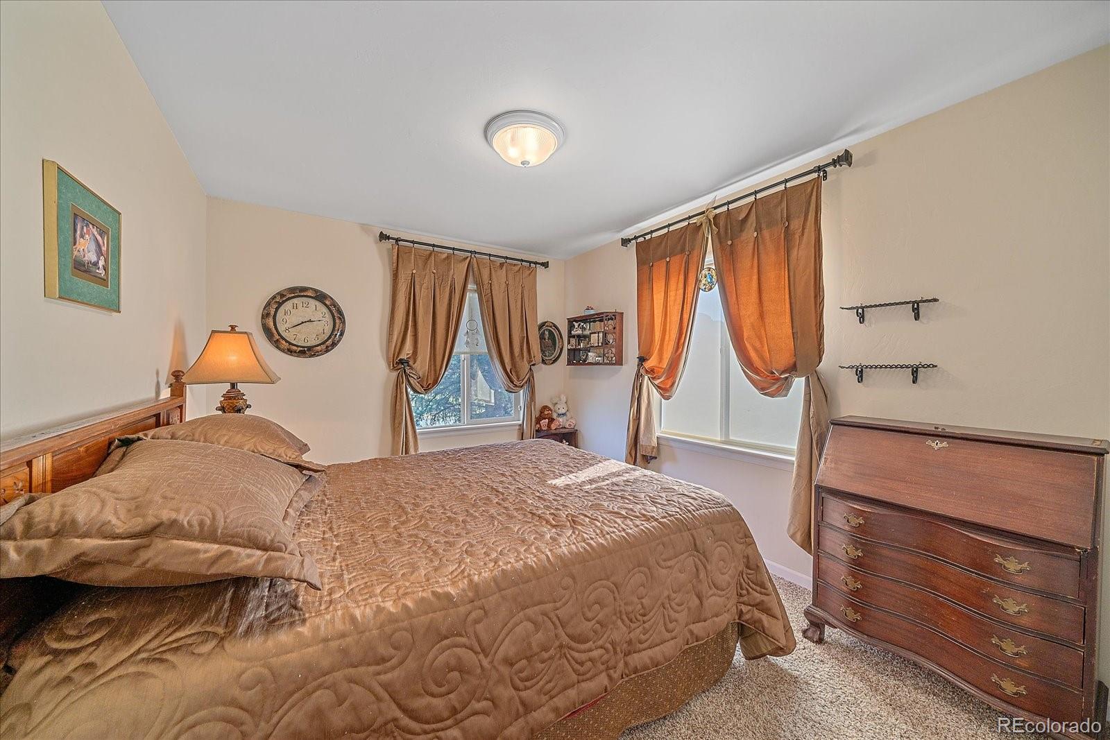 357 County Road 64 Shawnee, CO 80475 - Photo 20 of 50 a bed room with a bed and a painting on the wall