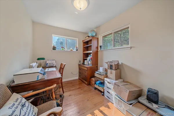 a reading room with furniture and a bookshelf