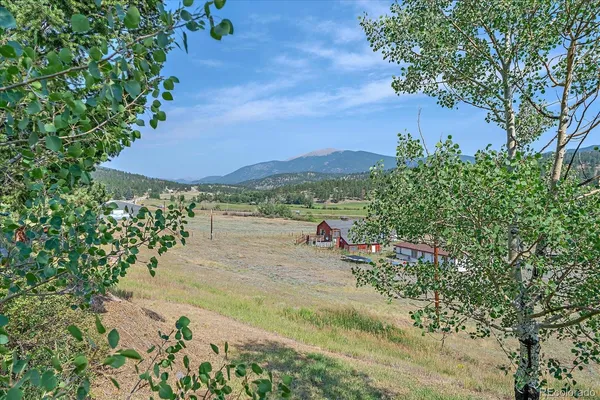 a view of a lake with a yard