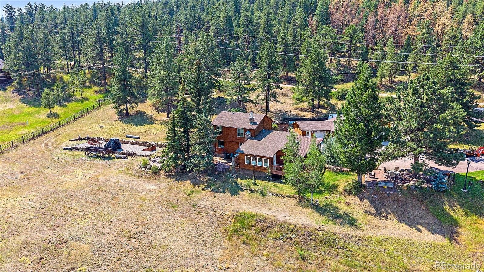 357 County Road 64 Shawnee, CO 80475 - Photo 32 of 50 an aerial view of a house with a yard and lake view