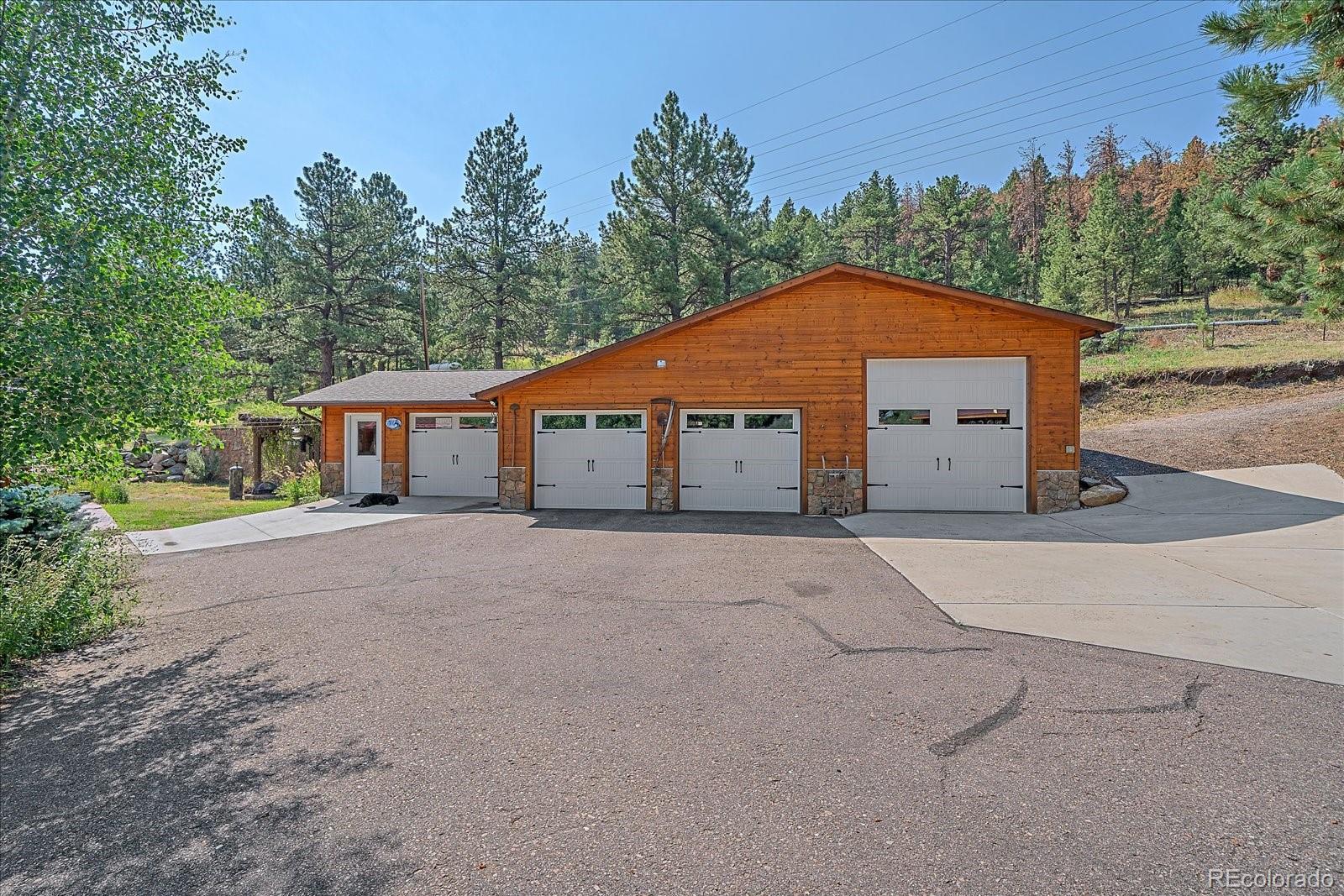 357 County Road 64 Shawnee, CO 80475 - Photo 38 of 50 a blue and white house with a yard