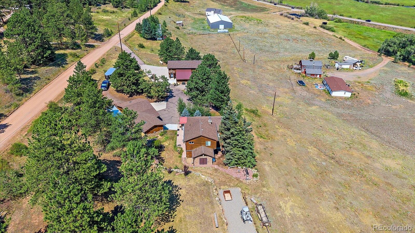 357 County Road 64 Shawnee, CO 80475 - Photo 46 of 50 an aerial view of a house with a yard and trees