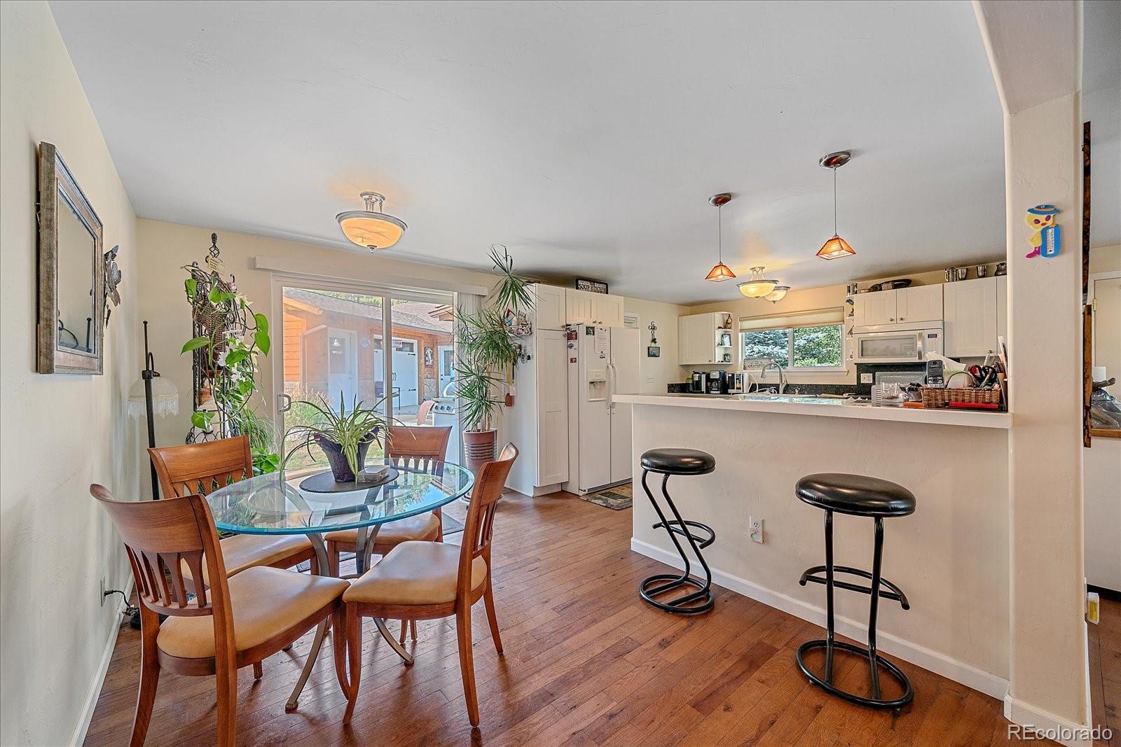 357 County Road 64 Shawnee, CO 80475 - Photo 9 of 50 a dining room with furniture and wooden floor