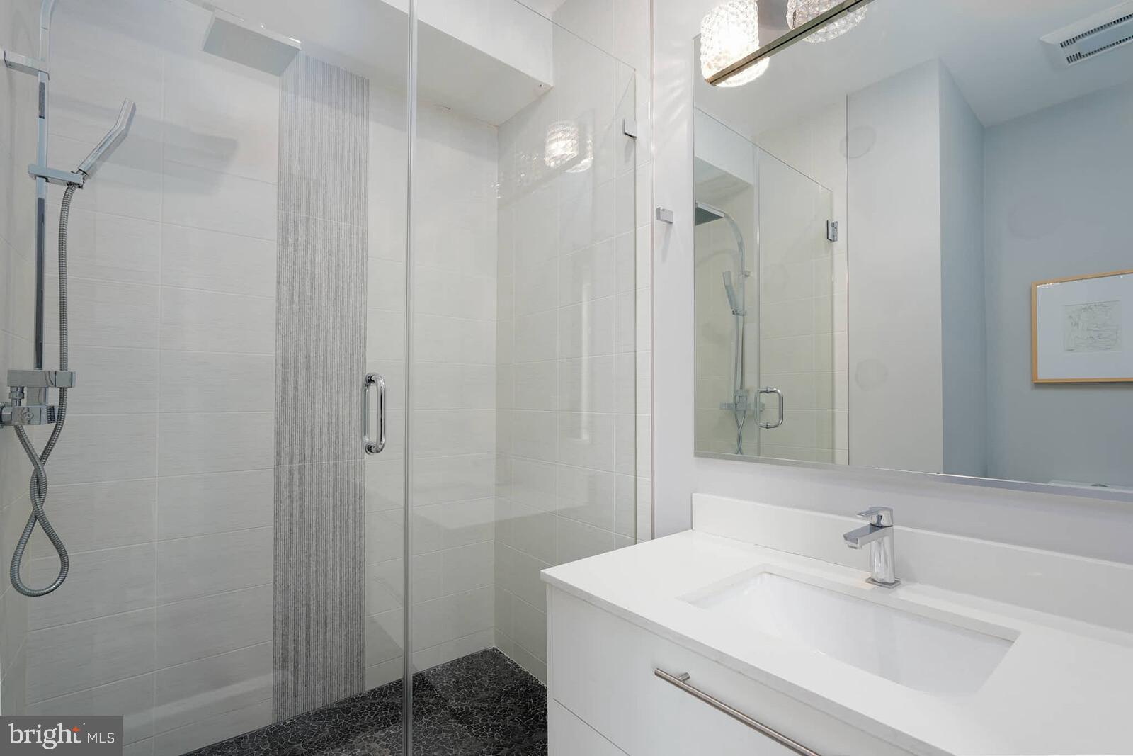 1461 Chapin Street Northwest Washington, DC 20009 - Photo 17 of 67 Sleek modern bathroom with elegant finishes.