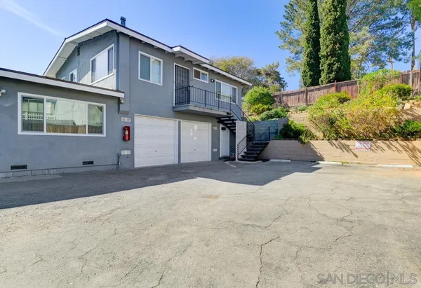 a view of a house with a street