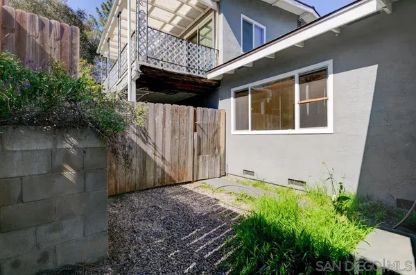a view of a backyard and a patio