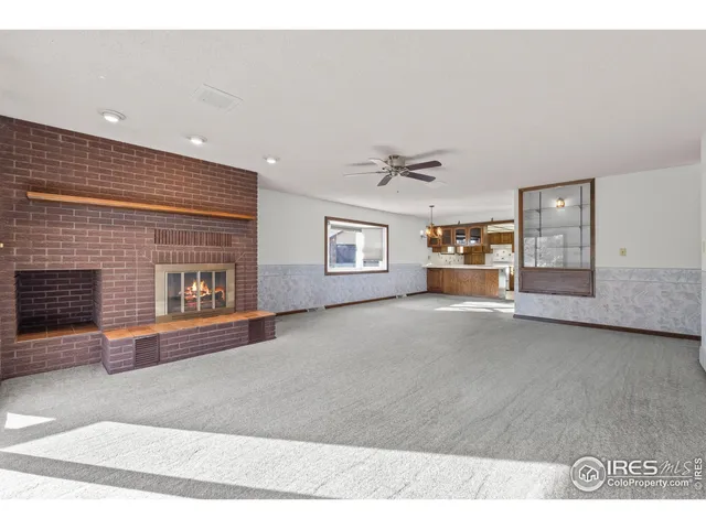 a kitchen with a stove a sink and a refrigerator