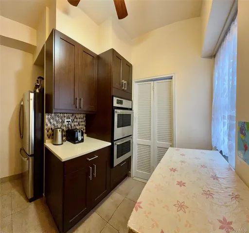 a kitchen with stainless steel appliances a refrigerator and a stove