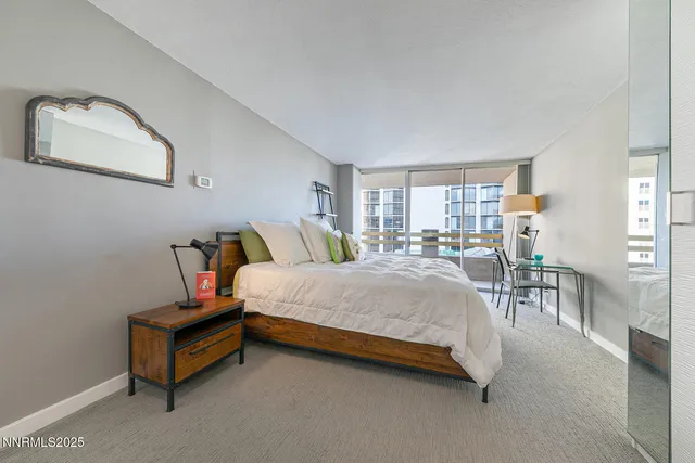 a spacious bedroom with a bed and window