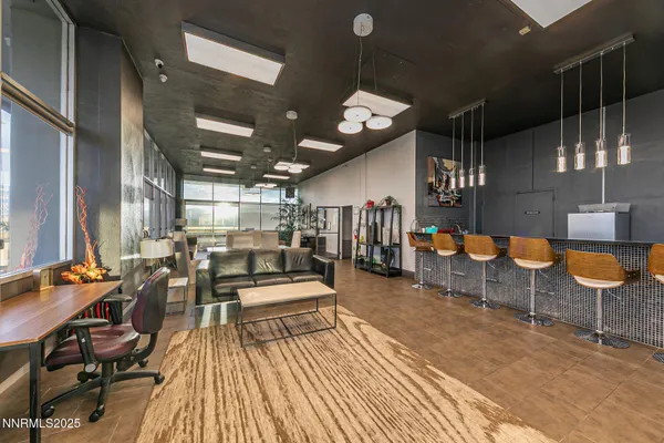 a very nice looking room with lots of furniture and lots of gym equipment