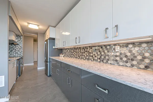 a view of kitchen with cabinets