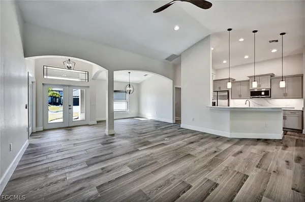a view of a kitchen with a sink and cabinets