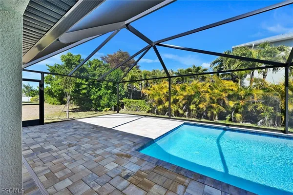 a bathroom with a granite countertop sink mirror and toilet