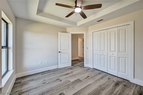 a bathroom with a granite countertop toilet a sink and bathtub