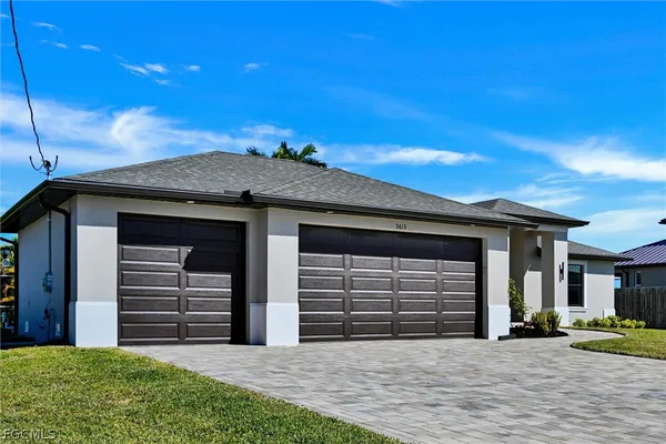 a front view of a house with a garage