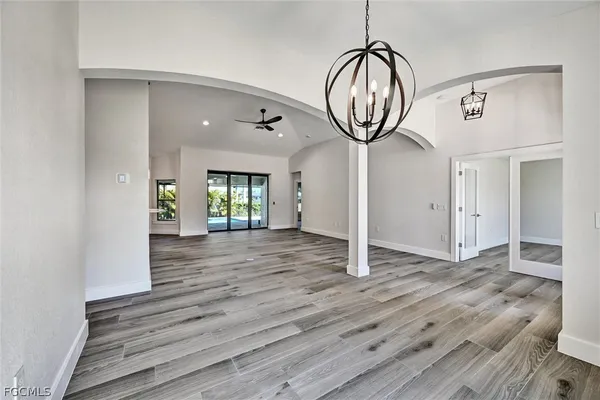 a view of room with wooden floor