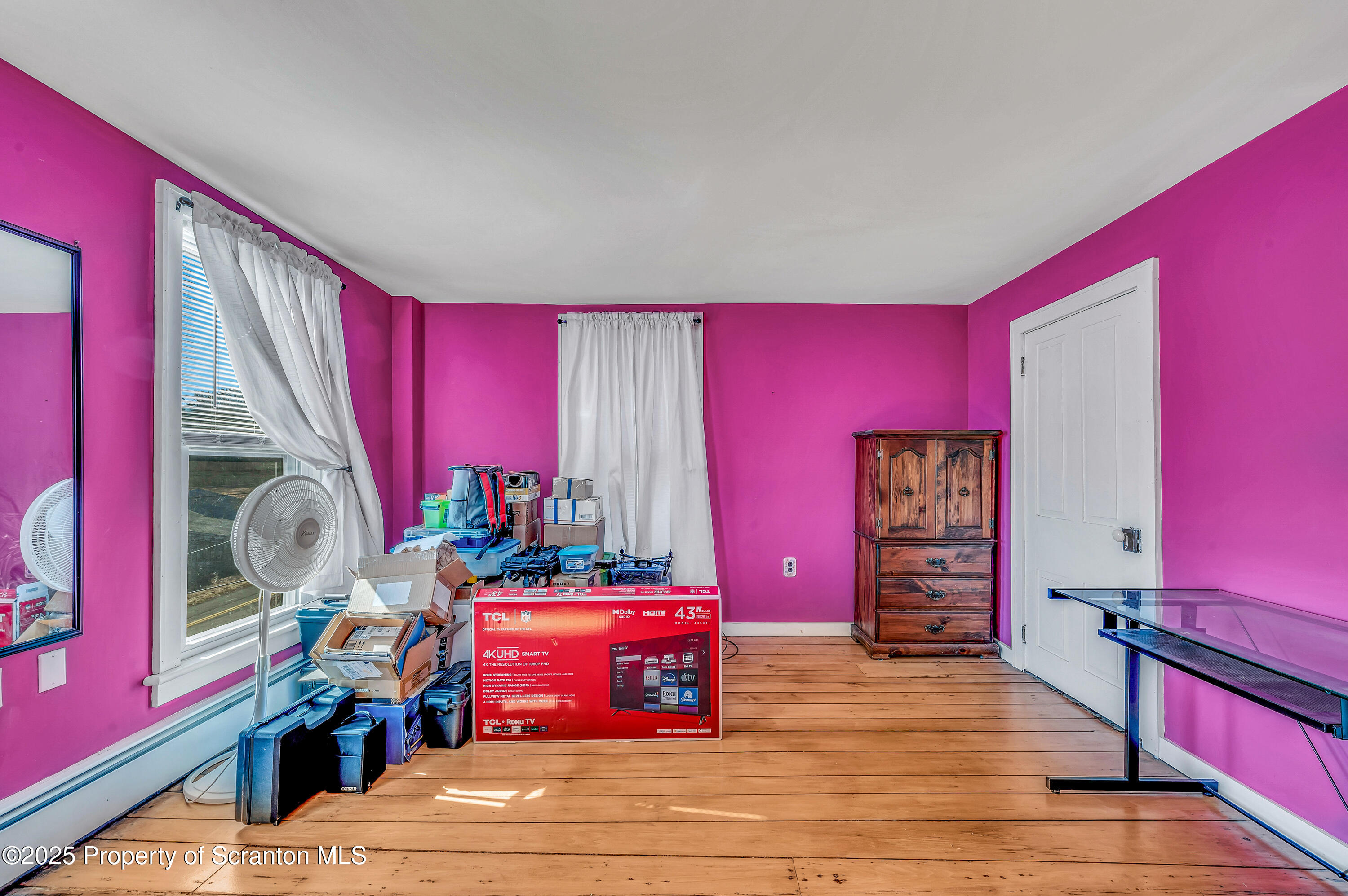 5115 State Rte 3013 Springville, PA 18844 - Photo 60 of 74 a living room with furniture a flat screen tv and a window