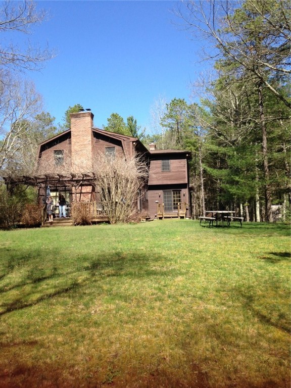 247 Nicholas Road Coventry, RI 02827 - Photo 4 of 34 SIDE OF HOUSE WITH SLIDER TO DECK AND PORTION OF BACK YARD