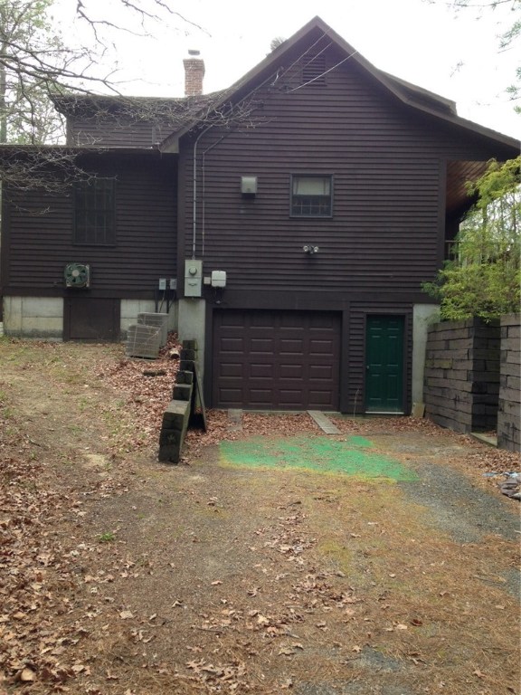 247 Nicholas Road Coventry, RI 02827 - Photo 7 of 34 INTEGRALGARAGE AND SECONDARY DRIVEWAY BACK OF YARD THAT GOES OUT TO MAIN ROAD
