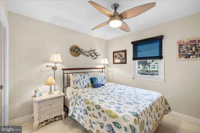 a spacious bedroom with a bed and a cabinets
