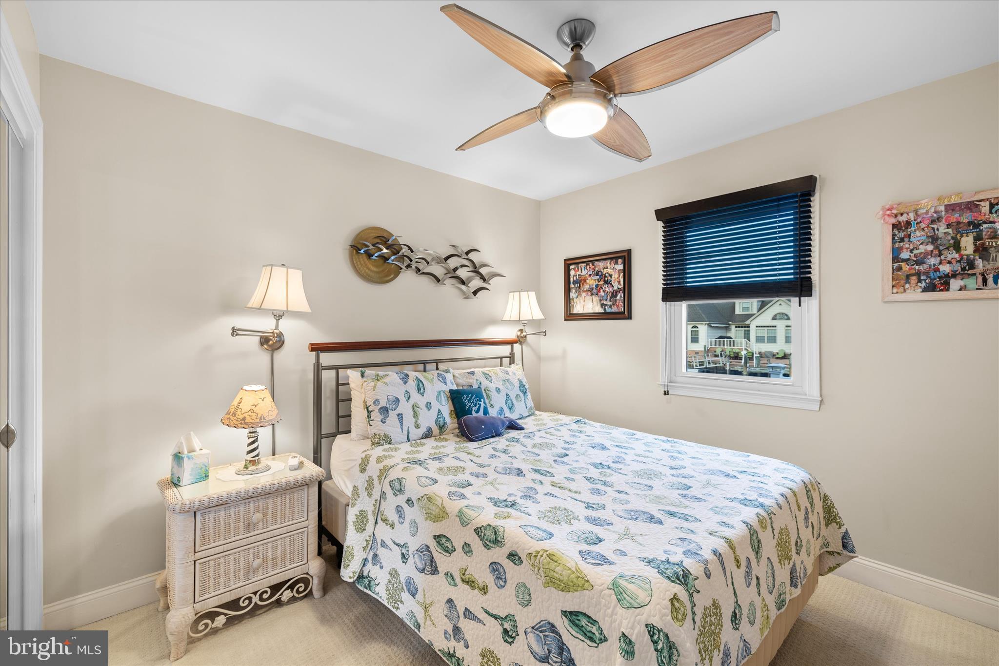 30 Marshall Road Rehoboth Beach, DE 19971 - Photo 24 of 77 a bedroom with a bed and a painting on the wall