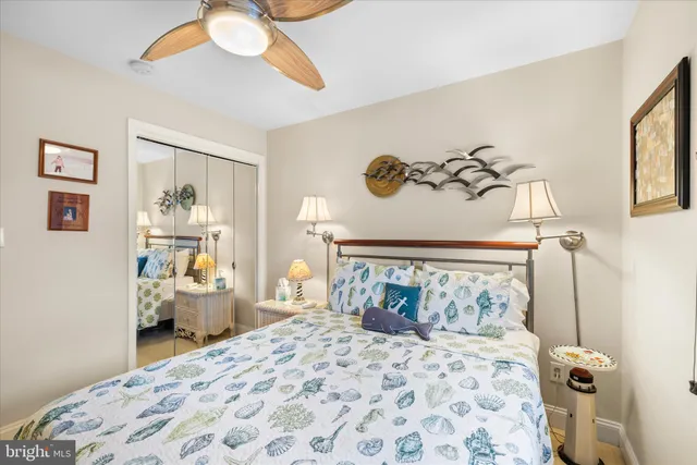 a bedroom with a bed and furniture with outer view