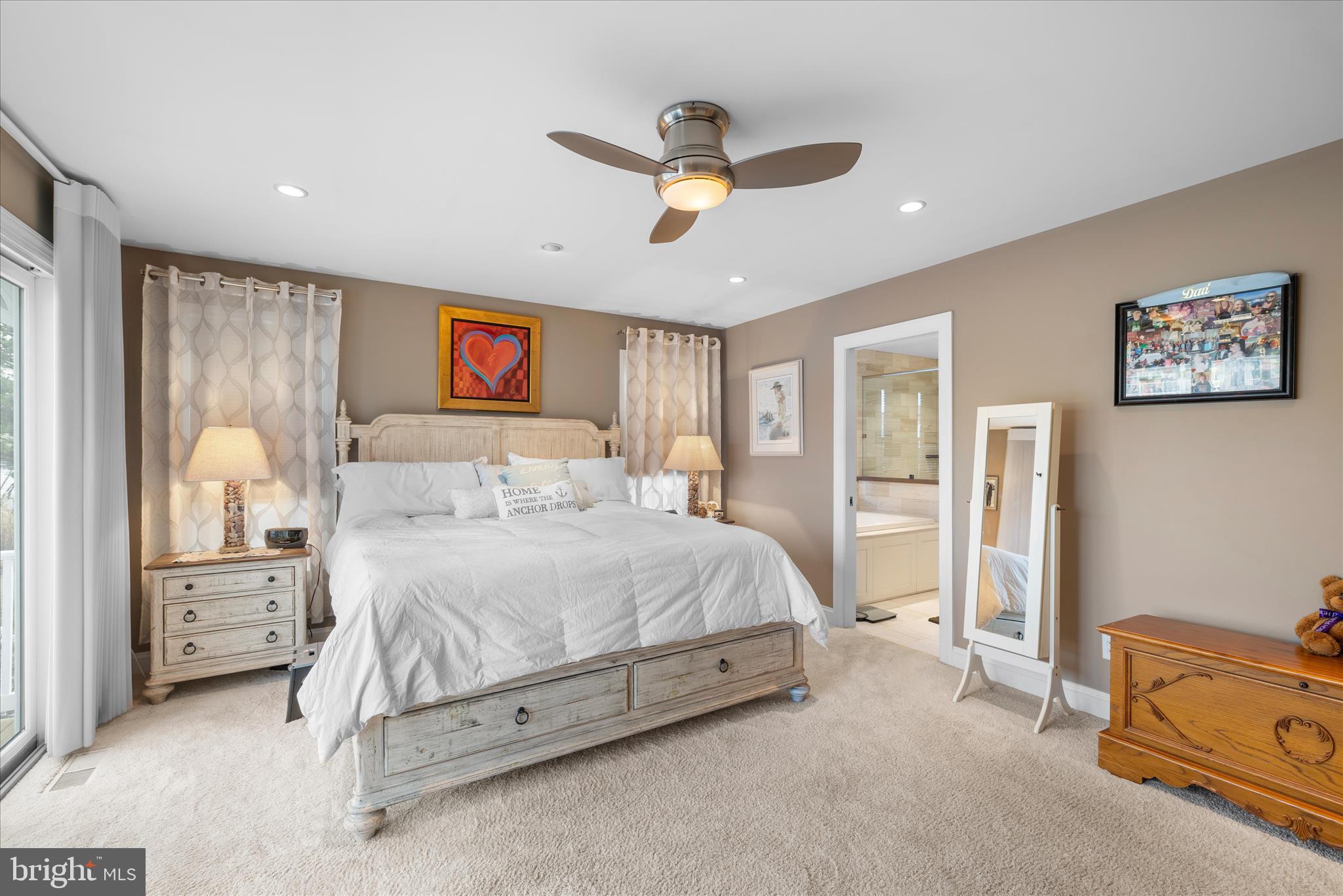 30 Marshall Road Rehoboth Beach, DE 19971 - Photo 29 of 77 a spacious bedroom with a bed and a cabinets