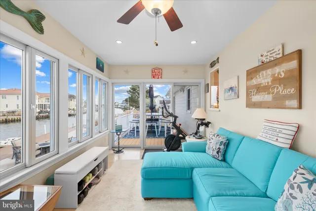 a view of a terrace with furniture and city view