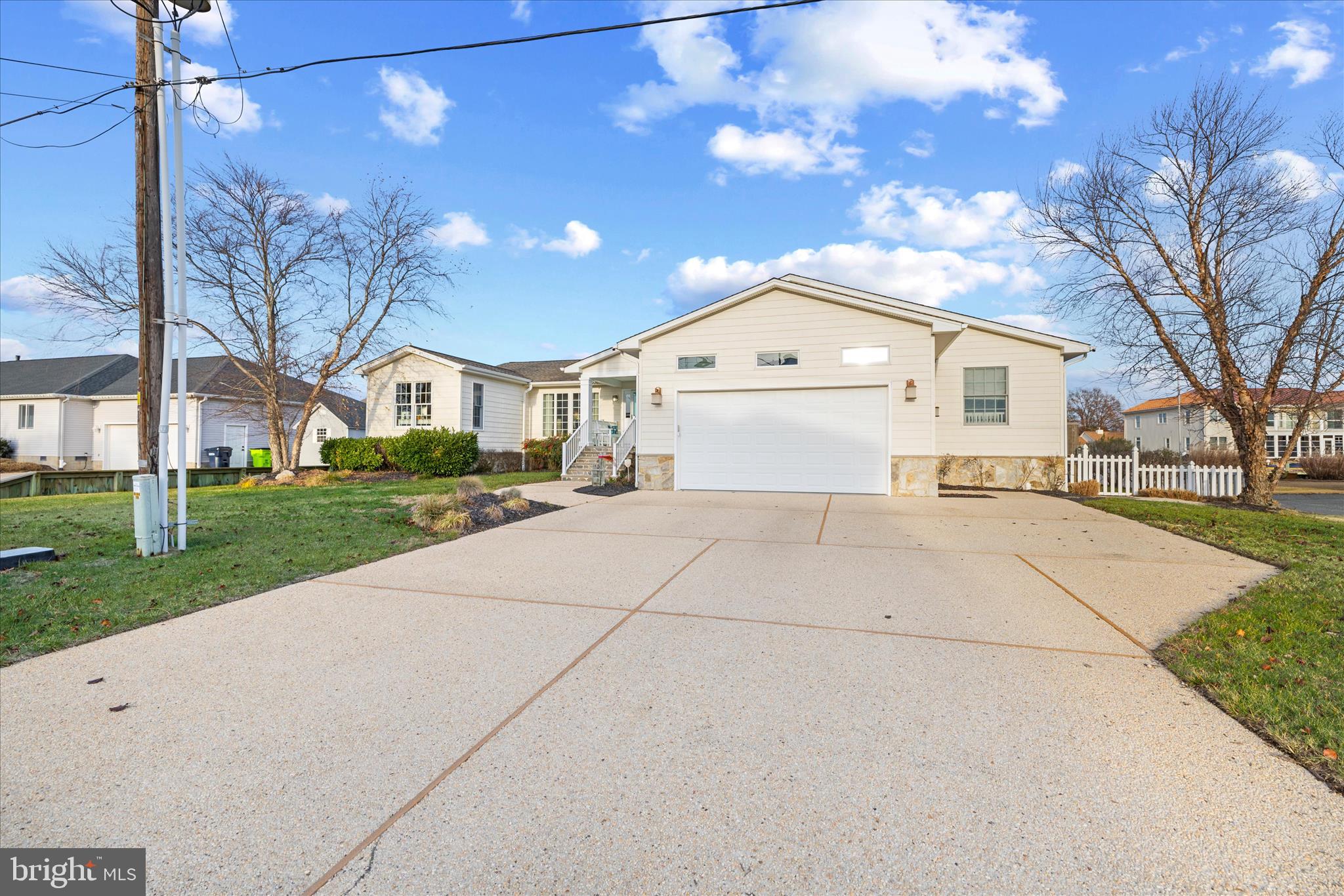 30 Marshall Road Rehoboth Beach, DE 19971 - Photo 5 of 77 a view of house with yard and garage