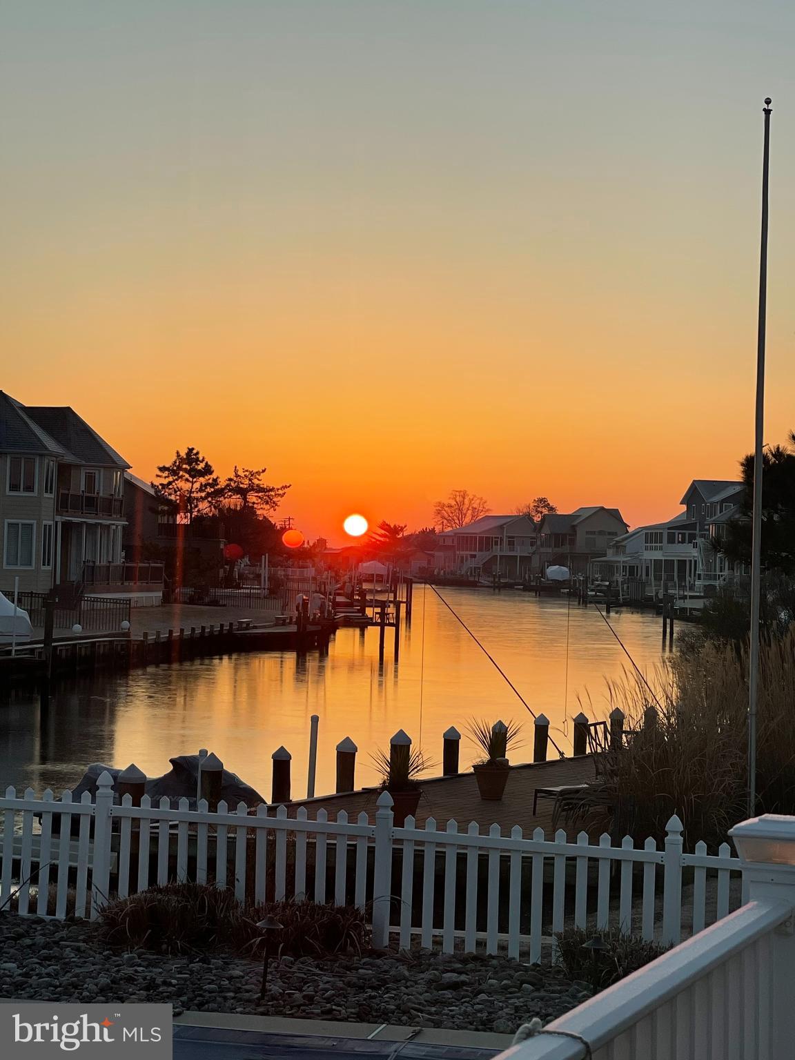 30 Marshall Road Rehoboth Beach, DE 19971 - Photo 74 of 77 a view of a lake with a terrace next to a lake