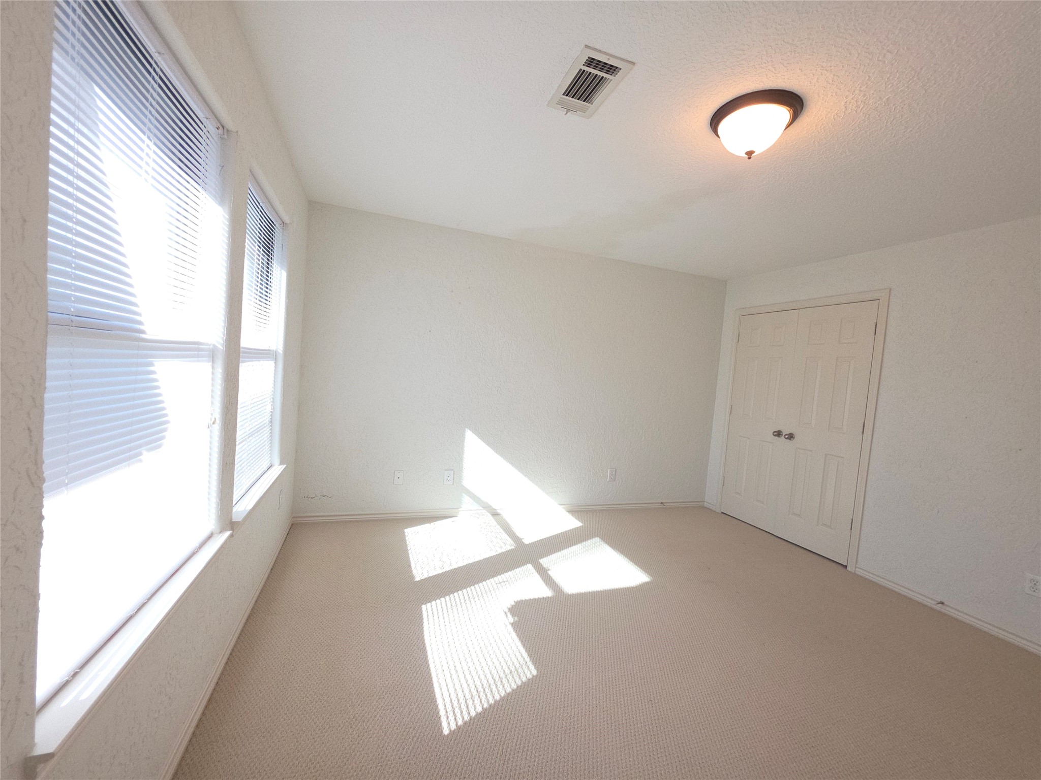 1898 Longmire Road, Unit 8 Conroe, TX 77304 - Photo 14 of 17 a view of an empty room with a window
