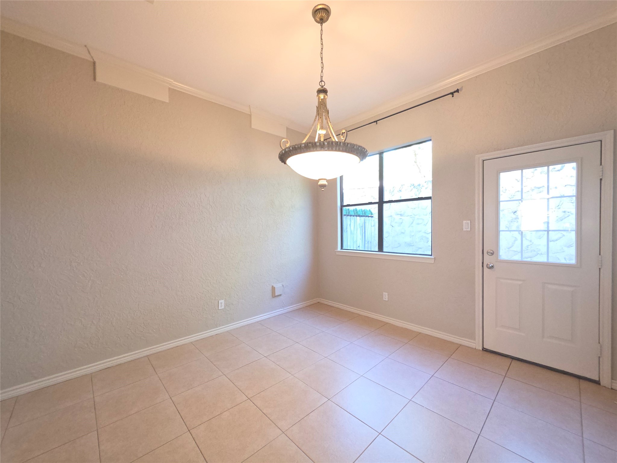 1898 Longmire Road, Unit 8 Conroe, TX 77304 - Photo 6 of 17 a view of an empty room with a window