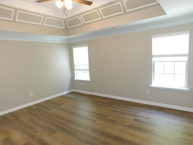 1834 Stephens Pond View Loganville, GA 30052 - Photo 21 of 25 an empty room with wooden floor and windows