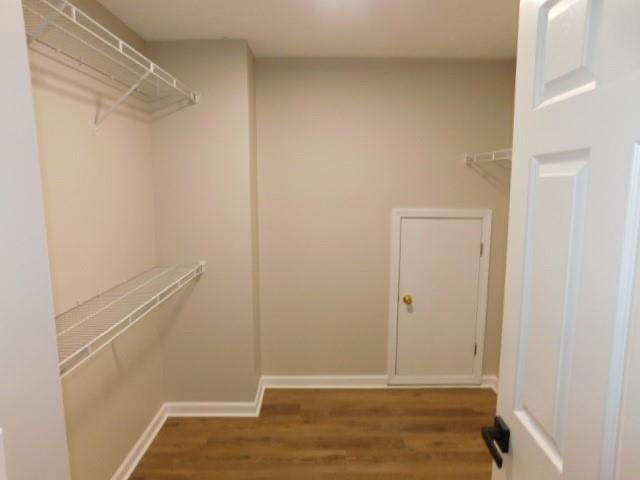 1834 Stephens Pond View Loganville, GA 30052 - Photo 22 of 25 a view of walk in closet with empty racks