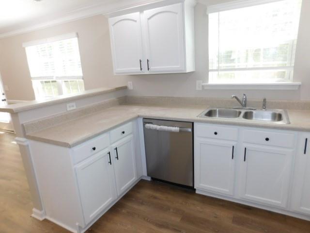 1834 Stephens Pond View Loganville, GA 30052 - Photo 6 of 25 a kitchen with white cabinets appliances a sink and a window