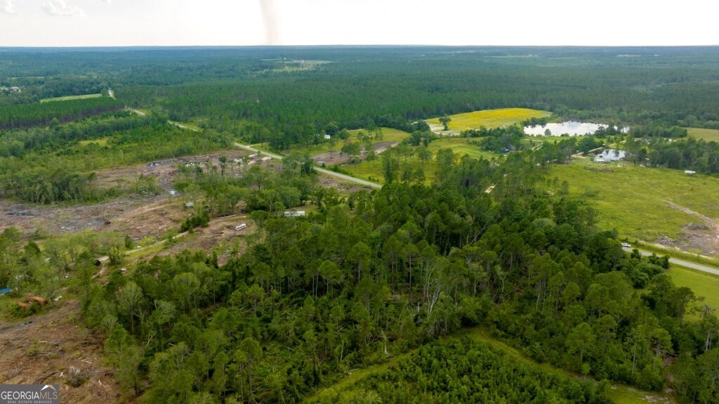 a view of a lake with a yard