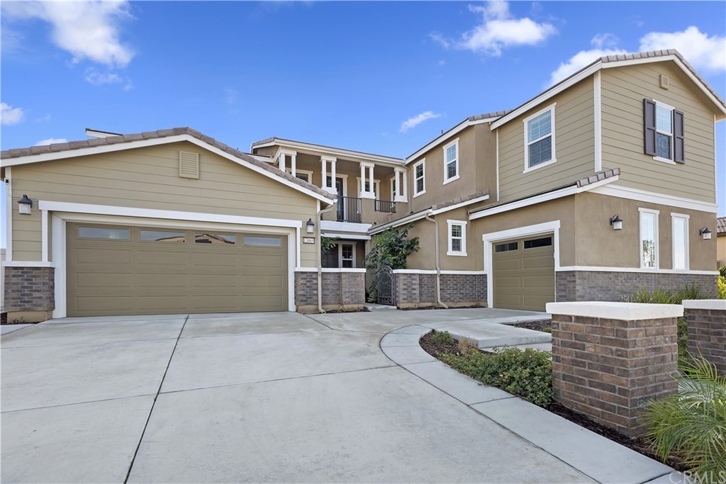 13869 Blanco Ln. Riverside, CA 92503 - Photo 1 of 1 a front view of a house with a garage
