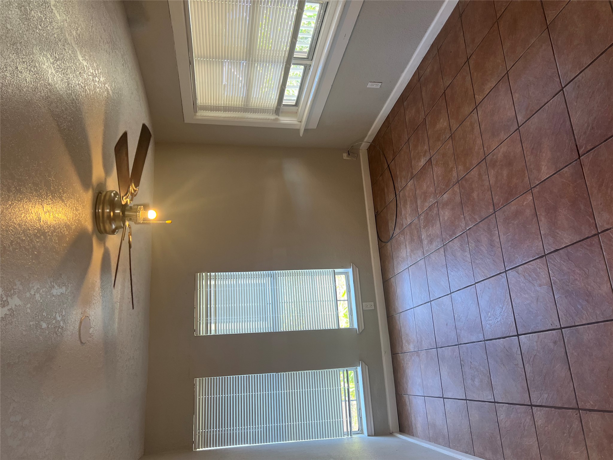 6405 Torres Street Austin, TX 78741 - Photo 3 of 14 Functional living space with tile floors and ample natural illumination.