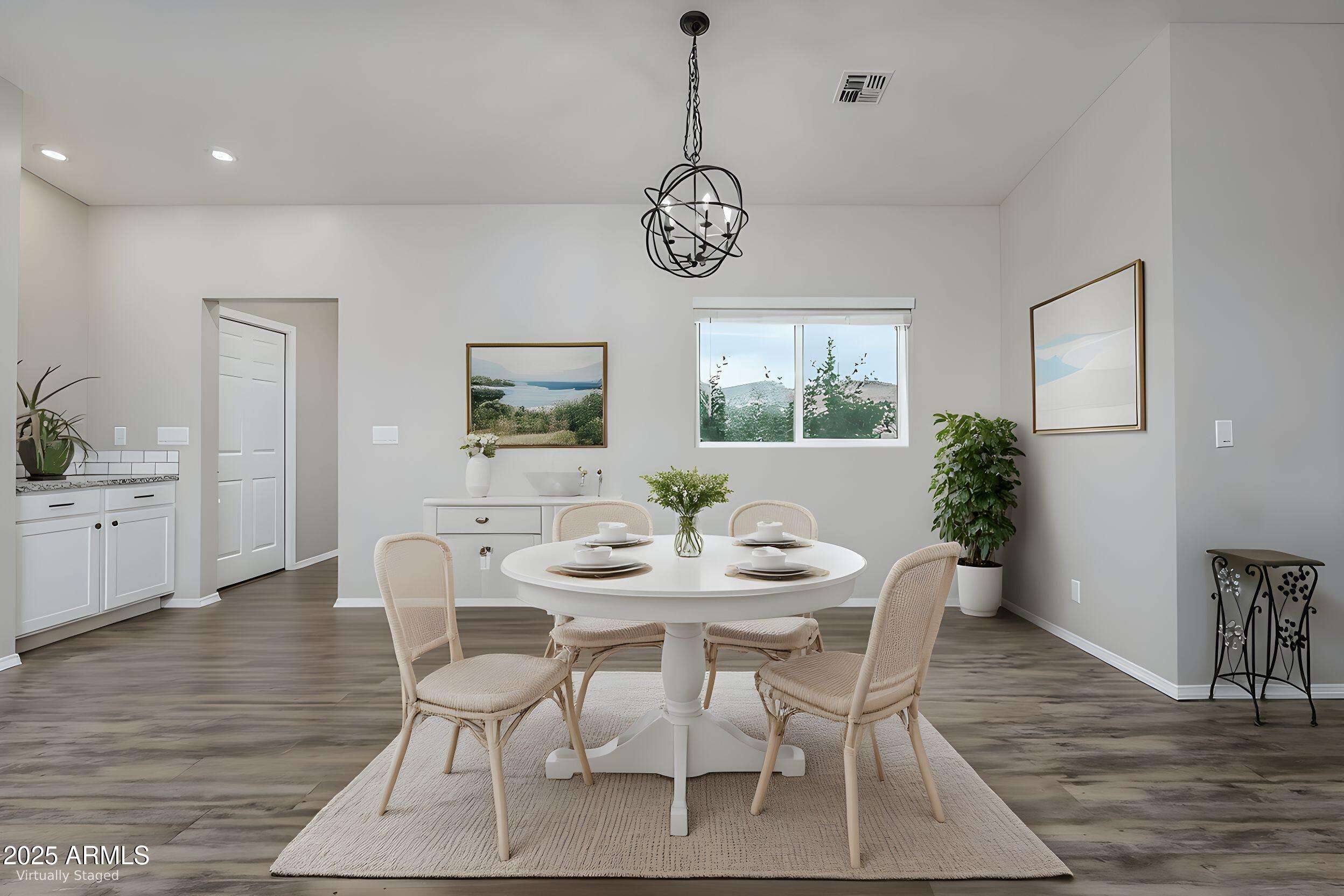 955 West Copperhead Road Camp Verde, AZ 86322 - Photo 11 of 35 a view of a dining room with furniture window and wooden floor