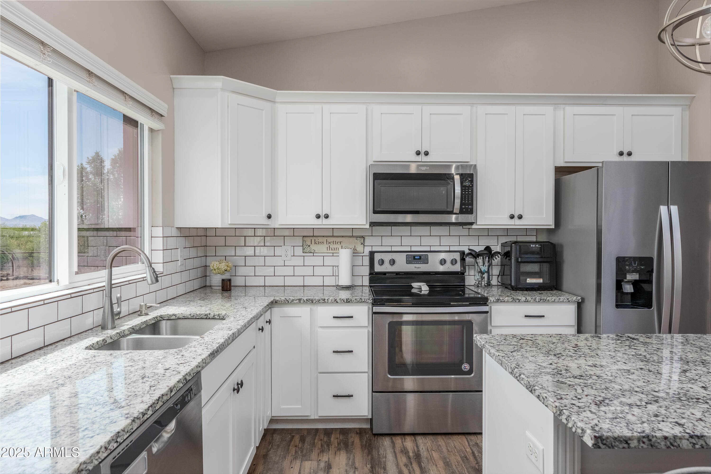 955 West Copperhead Road Camp Verde, AZ 86322 - Photo 24 of 35 a kitchen with granite countertop a sink stove and refrigerator