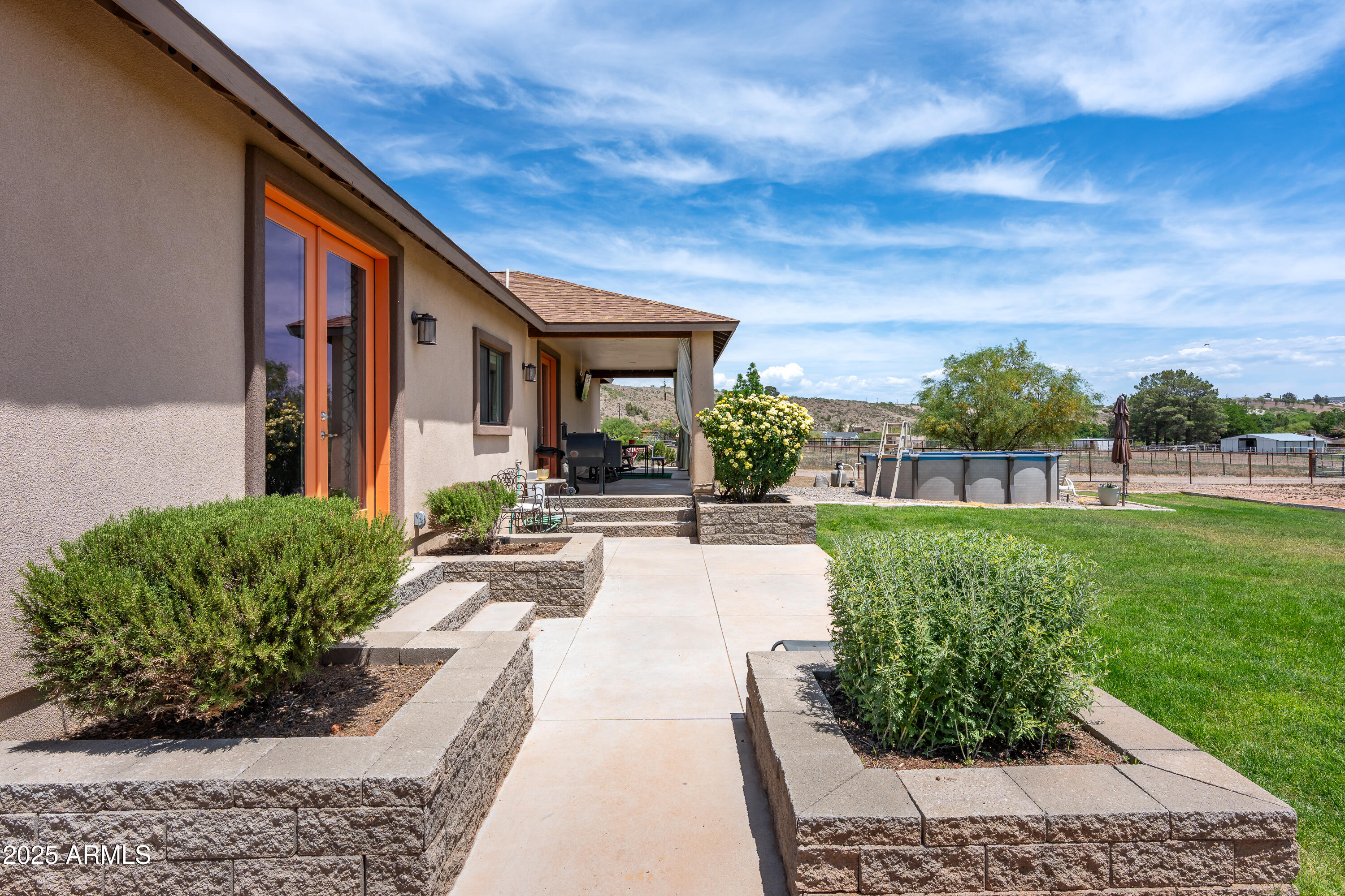 955 West Copperhead Road Camp Verde, AZ 86322 - Photo 29 of 35 a view of a house with backyard and a garden