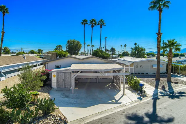 a view of a patio with furniture and a potted plants