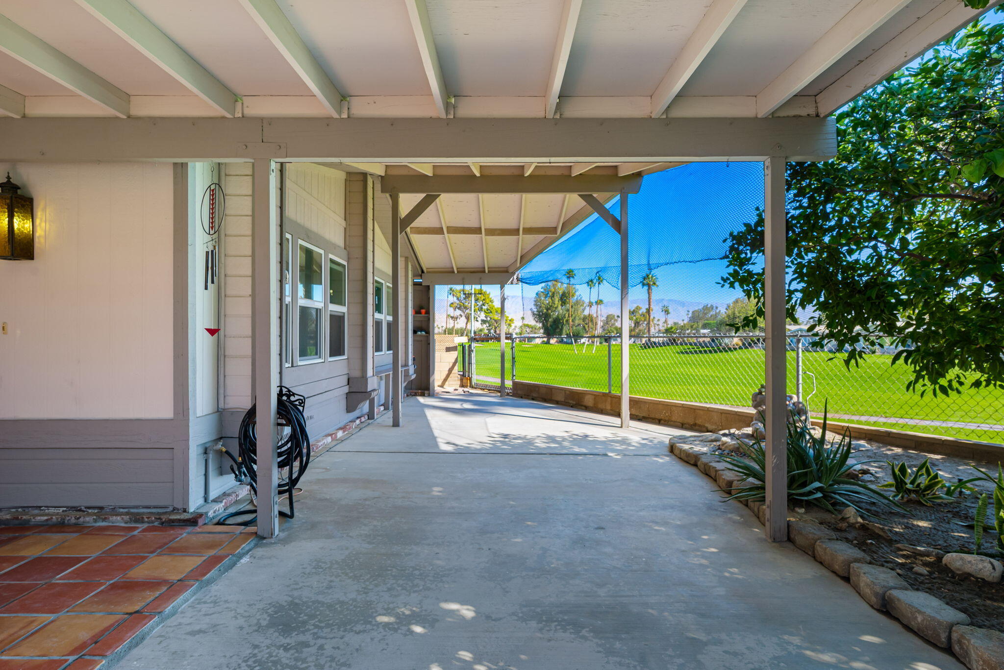 33204 Laredo Circle Thousand Palms, CA 92276 - Photo 15 of 62 a view of a house with porch and a yard