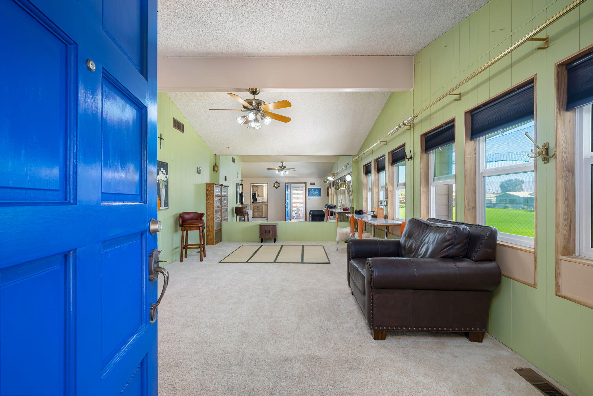33204 Laredo Circle Thousand Palms, CA 92276 - Photo 18 of 62 a living room with furniture and a large window