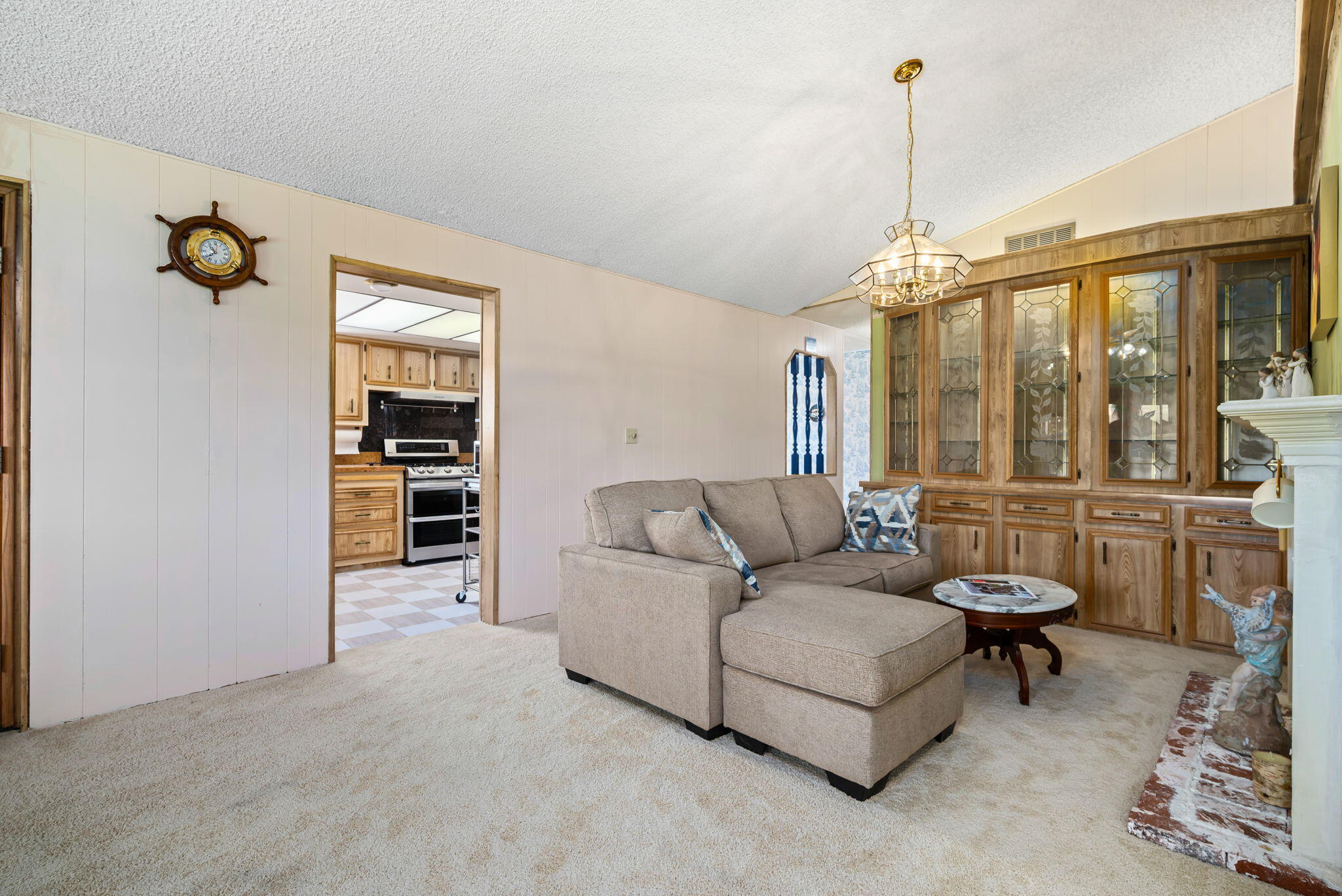 33204 Laredo Circle Thousand Palms, CA 92276 - Photo 23 of 62 a living room with furniture and a floor to ceiling window